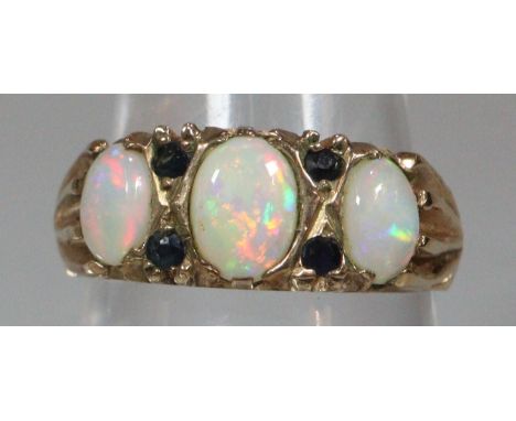 9ct gold and opal three stone ring.  3.2g approx.  Size O.  (B.P. 21% + VAT) 