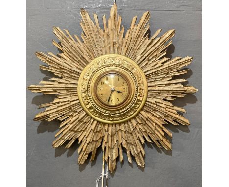 Mid 20th century gilt wood sun-burst clock with electric movement.  Overall 46cm diameter.  (B.P. 21% + VAT) 