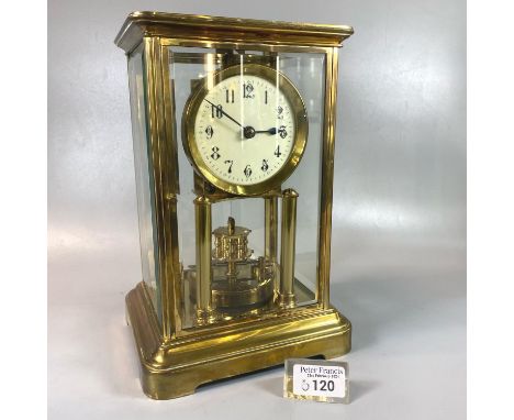 Early 20th century French brass four glass mantle clock with ceramic Arabic dial and compensated revolving pendulum.  27cm hi