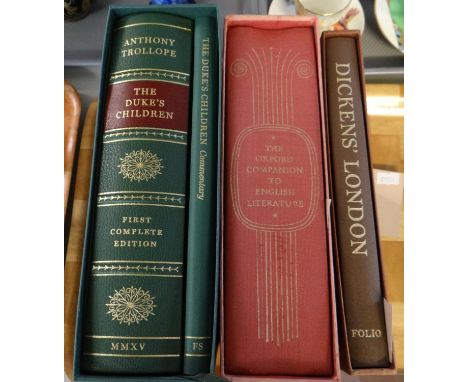 Various volumes in cases published by the Folio Society to include: 'Dickens' London', 'The Oxford Companion to English Liter