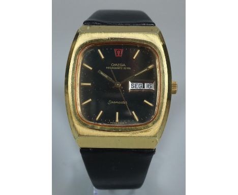Omega Megaquartz Seamaster gold plated day date gentleman's wristwatch, the face with Baton numerals and sweep seconds hand o