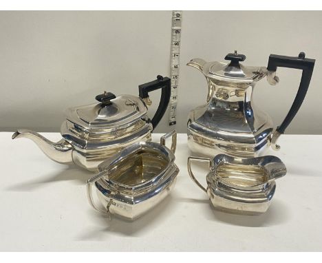 A solid silver tea service hallmarked for Birmingham 1933 consisting of teapot, coffee pot, cream jug and sugar bowl, with ba