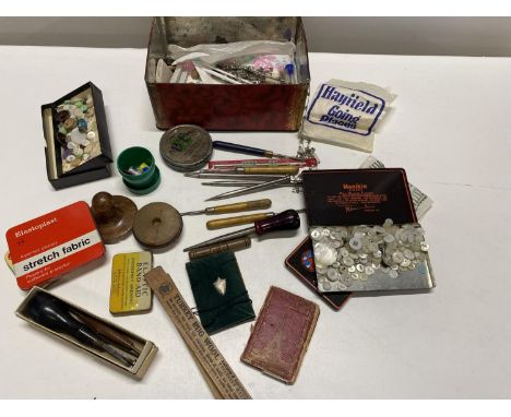 A vintage tin and contents of collectibles (sewing related)