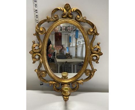 A vintage style gilt framed mirror and candle holder 55x40cm, shipping unavailable