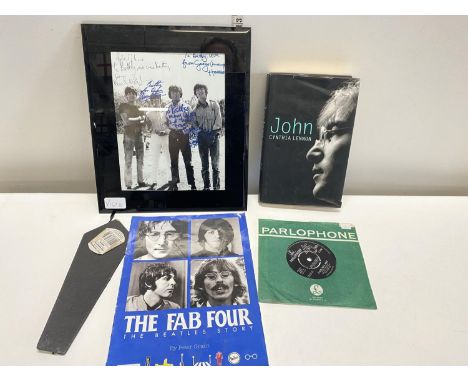 A selection of assorted Beatles ephemera including A Hard Days night single. The photo is not original and neither are the si