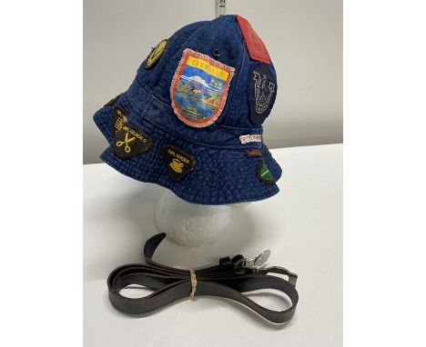 A Girl Guides hat and a vintage Scouts leather belt