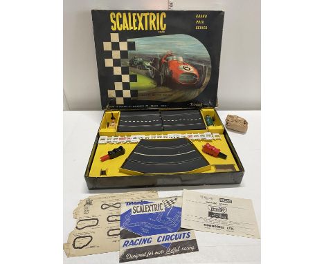 A vintage scalextric motor racing set complete with joysticks,cars and track.no power pack