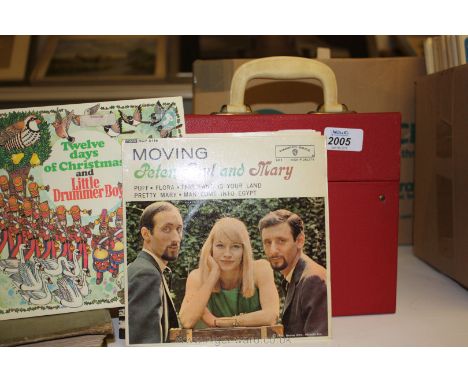 A vintage record case containing 45's including Peter Paul and Mary etc