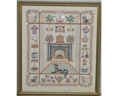 Framed cross stitch sampler