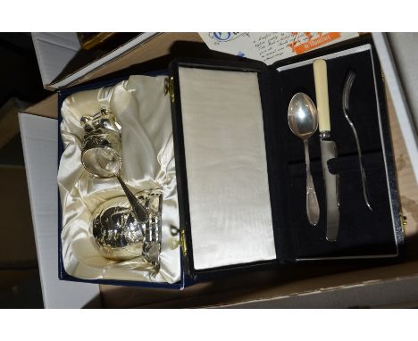 Cased silver knife, fork and spoon set and a Humpty Dumpty money box and egg cup set.