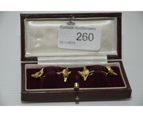 Pair of 9ct gold fox cub cuff links with ruby eyes 