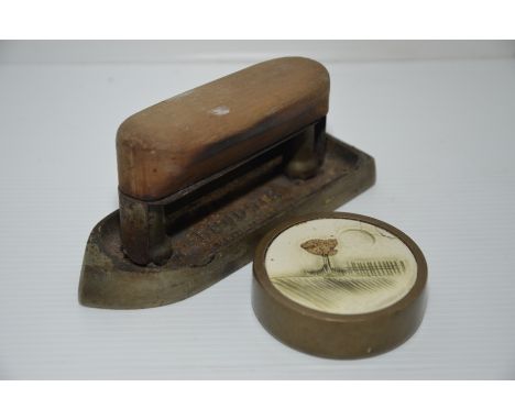 Shirt collar iron and brass paperweight with ceramic inset top 