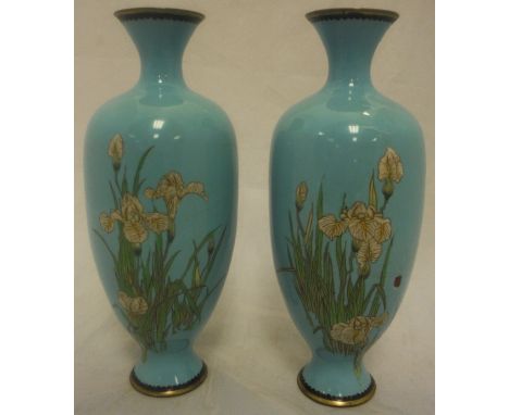 A pair of cloisonné vases decorated with lilies on a sky blue ground CONDITION REPORTS First vase has extensive cracking to t