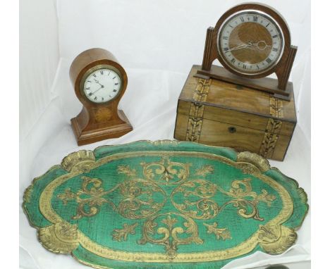 A mahogany and inlaid balloon-shaped mantle clock with Roman numerals to the dial, an early 20th Century oak cased mantle clo