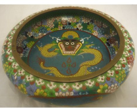 A Chinese cloisonné bowl decorated with dragon  to the central blue ground field surrounded by a border of flowers, four char