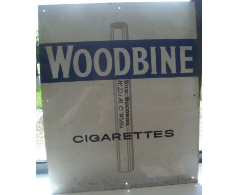 An enamel advertising sign "W D & H O Wills Woodbine, Wild Woodbine Cigarettes"