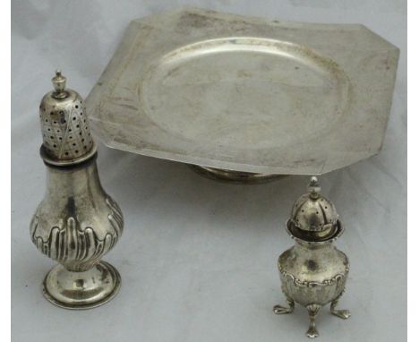 A Victorian silver sugar caster (Birmingham 1892 by Nathan & Hayes), a silver pepperette and an early 20th Century silver ped