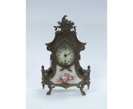 Continental Brass Cased Mantle Clock, with eagle finial, paw feet, lower porcelain panel featuring cherubs '607' to back. '38