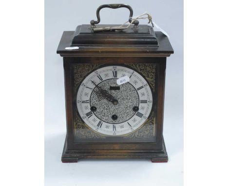 XX Century Kienzle German Mantel Clock, with brass carrying handle, white dial, and Roman numerals.