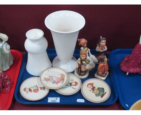 Hummel Figurines (x 4) the tallest 11cm, four 'Little Homemakers' plaques, two Wedgwood white ribbed vases.