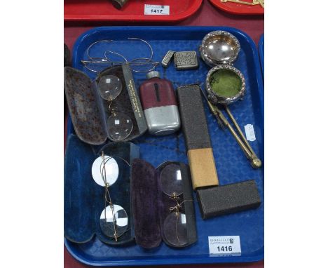 Four Pairs of Spectacles, brass compass, vesta case, hip flask, pair of plated salts:- One Tray.