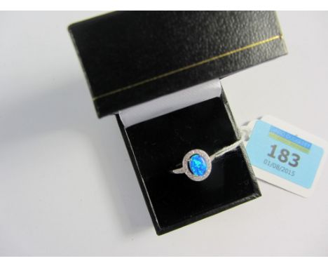 Blue opal and cubic zirconia cluster ring stamped 925