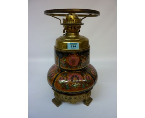 A Victorian ceramic body oil lamp, the cast brass base stamped 'Messenger'