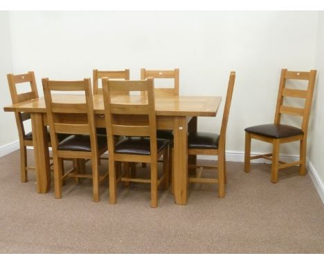 Light oak extending dining table (L140cm x W90cm) with fold out leaf (L180cm) and seven chairs