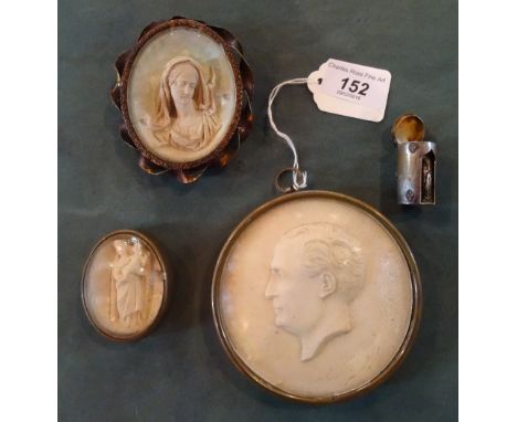 Two brass framed oval plaster Intaglios, each with religious themes, together with a circular brass framed plaster Intaglio, 