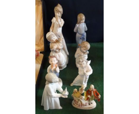 Eight ceramic figurines to include: Lladro, Nao and other examples.