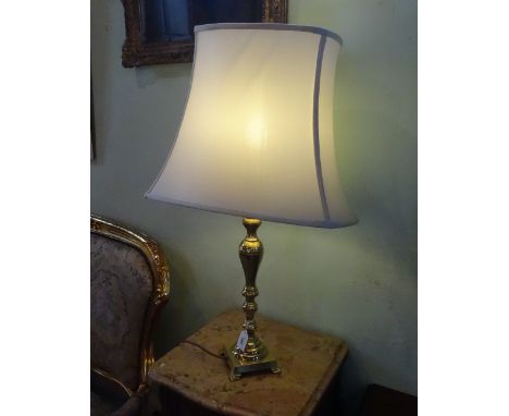 A tall brass table lamp on square base (80cm to include shade).