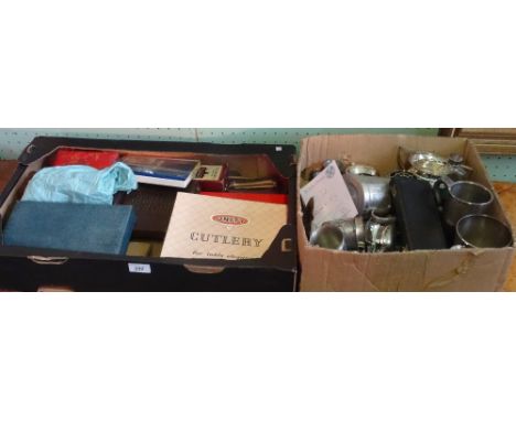 Two boxes containing a quantity of silver plated flatware, tankards and other items.