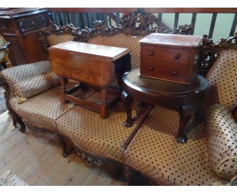A small oak drop-leaf table, together with a mahogany trinket chest and an oval upholstered stool.