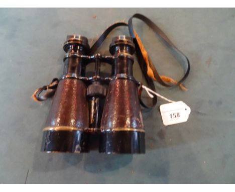 A pair of WWII Naval binoculars, stamped with a broad arrow and S.361007.