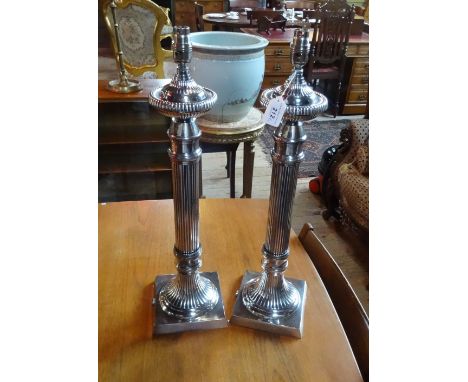 A pair of silver plated table lamp bases, having reeded columns on a square base (60cm).