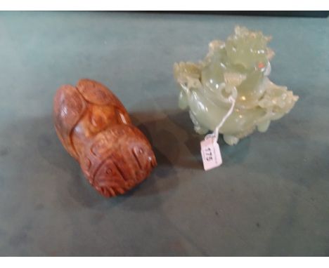 A mid-20th century hardstone carving, modelled as a stylized cicada (14cm), together with a carved pale green jade koro and c