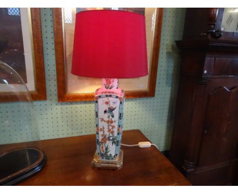 A contemporary ceramic and gilt metal table lamp, decorated in the Chinese manner with birds and foliage (61cm to include sha