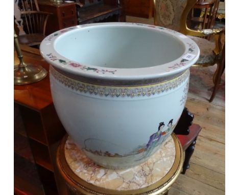 A Chinese ceramic jardiniere or imposing proportions, decorated with female figures in a garden setting and verse to the exte