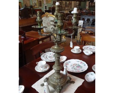 A Victorian brass five sconce candlestick on four lion and paw supports.