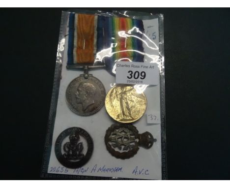 A WWI Campaign and Victory medal to 22636 A/CPL A. Markham, A.V.C., together with a silver ringed badge and a pre-1920 AVC ca