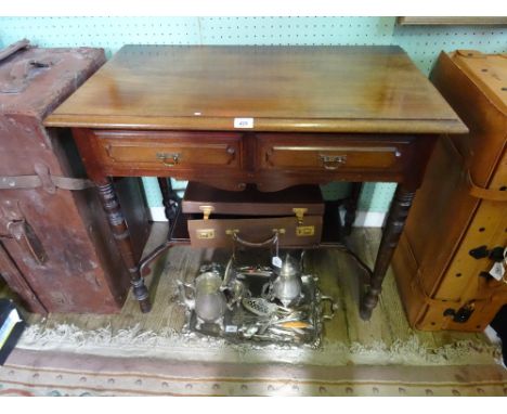 A mahogany two drawer side table, having lower shelf uniting the four turned supports.