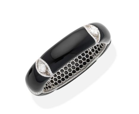 An onyx and diamond bangle, by VivaDesigned as a series of onyx panels interspersed by clusters of shield-shaped diamonds or 