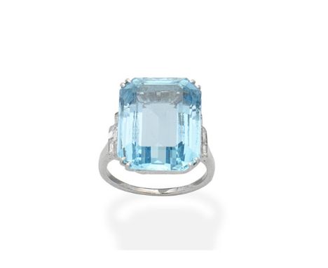 An aquamarine and diamond ringThe step-cut aquamarine between similarly-cut diamond shoulders, diamonds approx. 1.00ct total,