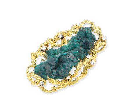 A dioptase, diamond and gold brooch, by Alan Martin Gard, 1972The large green dioptase crystal within a textured openwork 18 