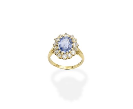 A sapphire and diamond cluster ring, by Barnet Henry Joseph, circa 1900The oval-cut sapphire within a surround of old brillia