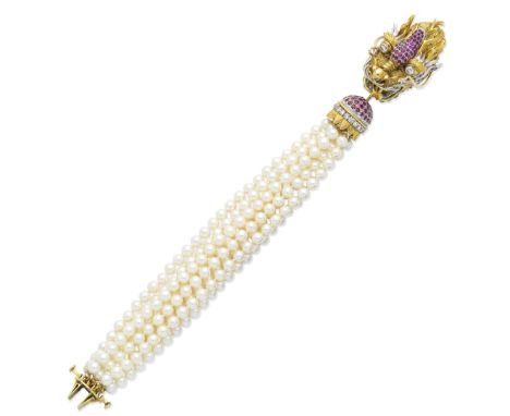 A diamond, ruby and cultured pearl braceletThe clasp designed as the head of a Chinese dragon, the eyes set with brilliant-cu