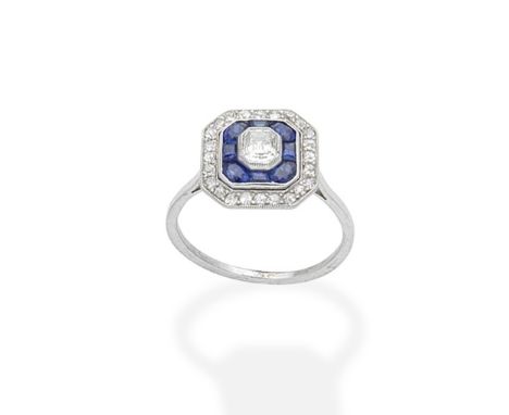 A sapphire and diamond plaque ring, circa 1920Of geometric design, the central step-cut diamond within tiered surrounds of ca