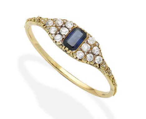A sapphire and diamond bangleSet with a step-cut sapphire between old brilliant and rose-cut diamond panels, the shoulders wi