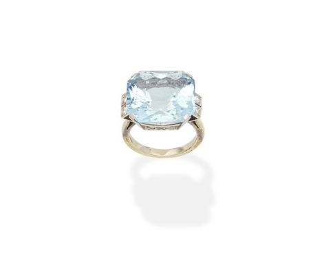 An aquamarine and diamond ringThe octagonal fancy-cut aquamarine between brilliant-cut diamond shoulders, ring size approx. K