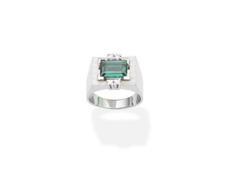 A tourmaline and diamond ring, circa 1970The step-cut tourmaline within an openwork reeded surround, accented by duos of bril